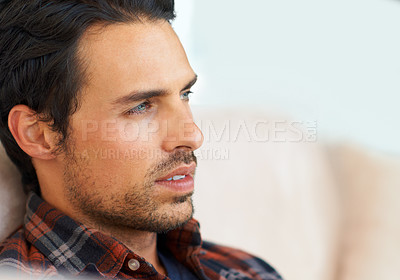 Buy stock photo Man, thinking and serious on sofa for idea, question and calm expression in living room of apartment or home. Person, face and confidence or thoughtful on couch in lounge for chill or rest on weekend