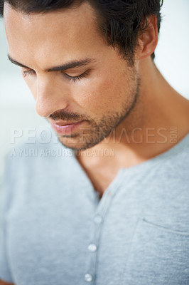 Buy stock photo Face, thinking and regret with a young man closeup on a white background for error, mistake or fail. Depression, sad or worry and a concerned young person looking down with stress or anxiety