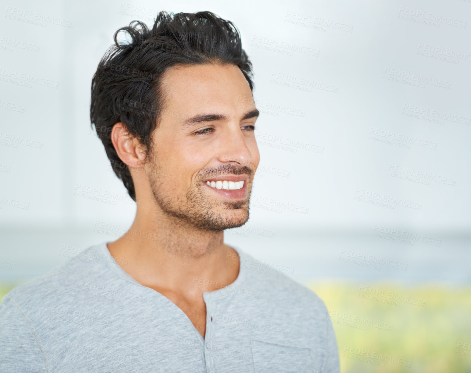 Buy stock photo Cropped shot of a handsome young man at home