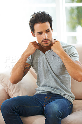 Buy stock photo Man, sofa and take off tshirt in a house for comfort, rest or chilling on weekend, day off or vacation. Sweater, removal or male person in a living room undressing, relax and ready to be comfortable