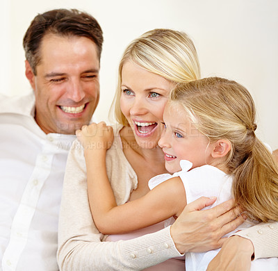 Buy stock photo Family, face and happy on sofa with hug, relax and love for bonding and relationship in living room. Parents, girl child or kid with smile on couch of lounge with embrace, break and care in home
