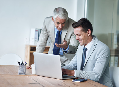 Buy stock photo Senior businessman, employee and laptop for advice, leadership and mentor on technology. Businesspeople, consulting and support or feedback on report, proposal and discussion or teaching in office