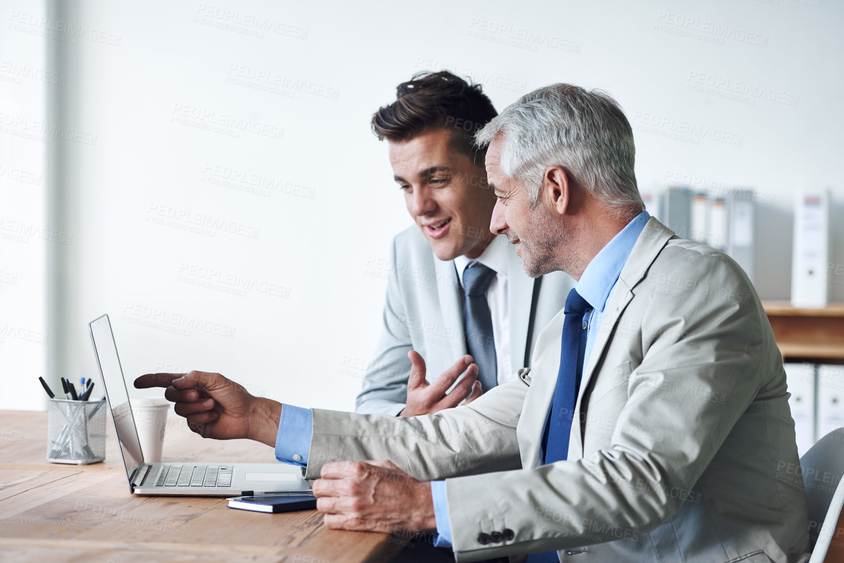 Buy stock photo Senior businessman, employee and laptop for consulting, leadership and mentor on technology. Businesspeople, ideas and advice or feedback on report, proposal and discussion or teaching in office