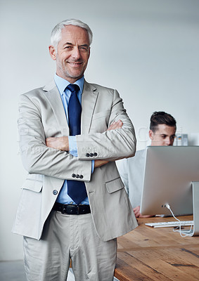 Buy stock photo Senior businessman, portrait and confidence in career, agency and pride for mentoring in office. Male person, arms crossed and smiling for support in management, advisor and computer for planning