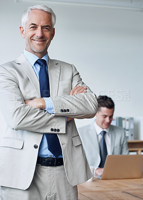 Buy stock photo Senior businessman, portrait and confidence in management, agency and pride for mentoring in office. Male person, arms crossed and happy for support in training, advisor and laptop for planning