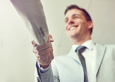 Buy stock photo Handshake, business people and agreement in partnership, teamwork and thank you for recruitment. Male person, low angle and deal for merger in workplace, collaboration and support in cooperation