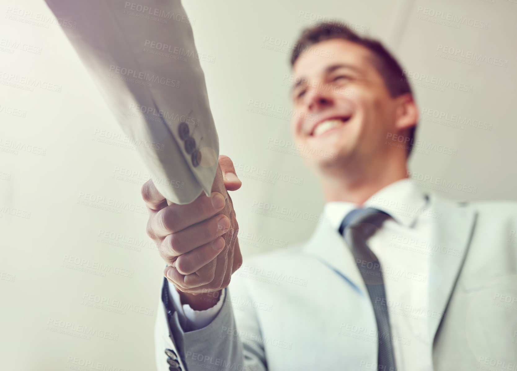 Buy stock photo Handshake, business people and agreement in partnership, teamwork and thank you for recruitment. Male person, low angle and deal for merger in workplace, collaboration and support in cooperation