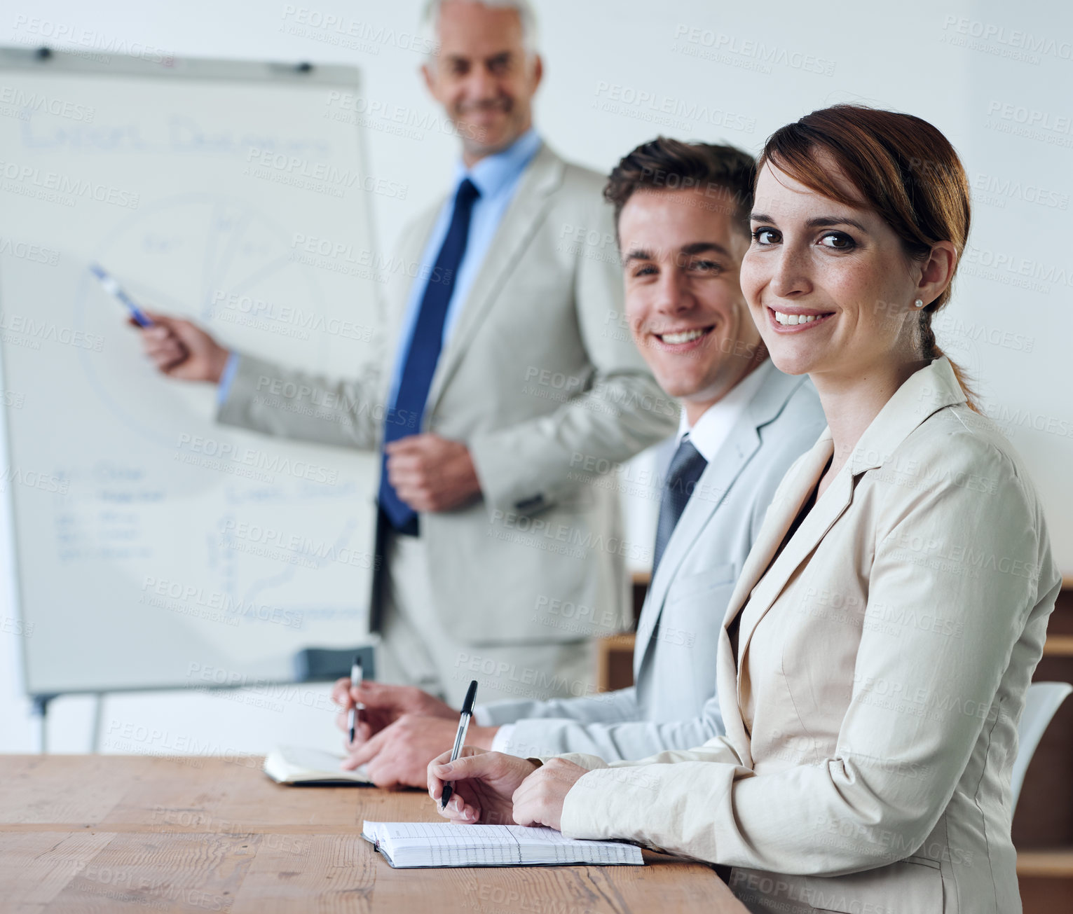 Buy stock photo Portrait or business people or boss teaching in a meeting for presentation, coaching or team training. Smile, man or woman in boardroom meeting for skills, group learning or education in a mentorship