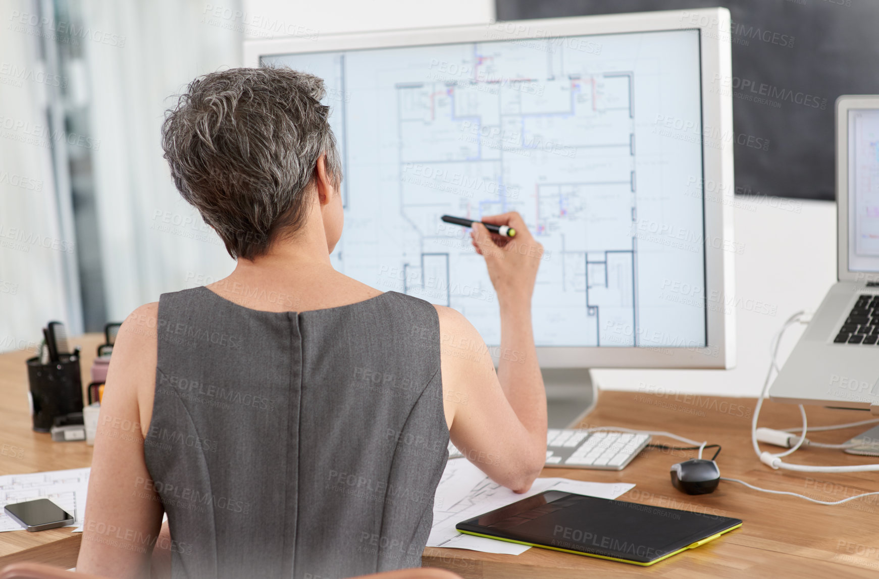 Buy stock photo Mature woman, architect and blueprint with computer screen, planning and design for vision or project. Back, female person and technology as designer or creative in management, office and development