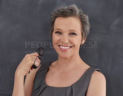 Buy stock photo Blackboard, glasses and portrait of teacher woman in classroom for development, education or lesson. Chalkboard, makeup and smile with happy mature person at school for growth, learning or teaching