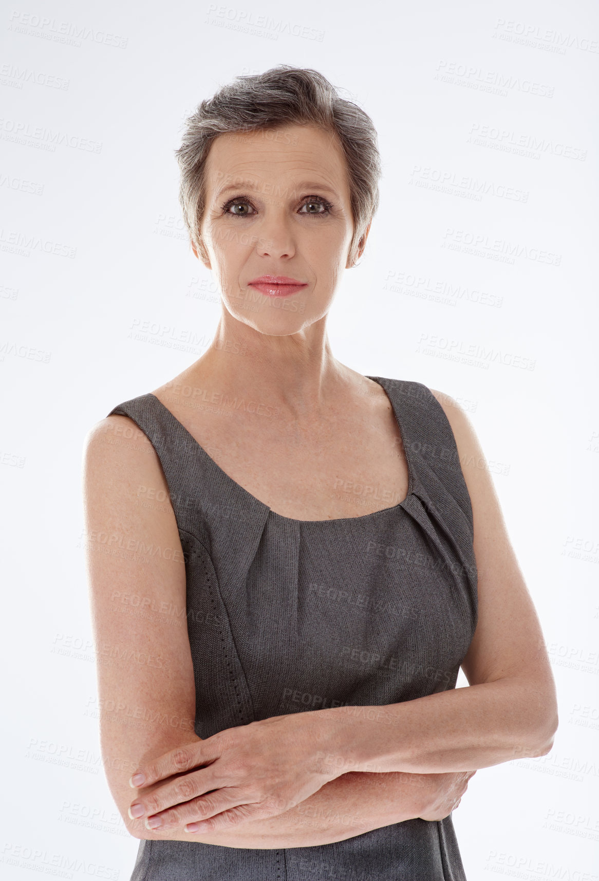 Buy stock photo Studio portrait of a confident mature businesswoman standing against a white background