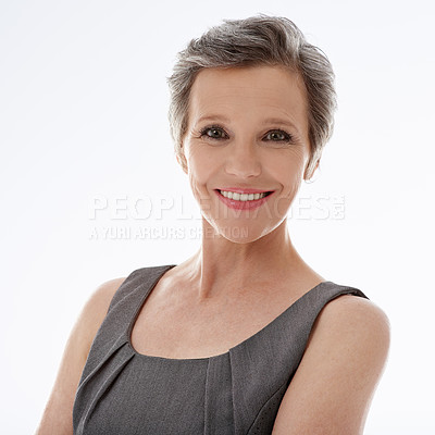 Buy stock photo Studio portrait of a confident mature businesswoman standing against a white background
