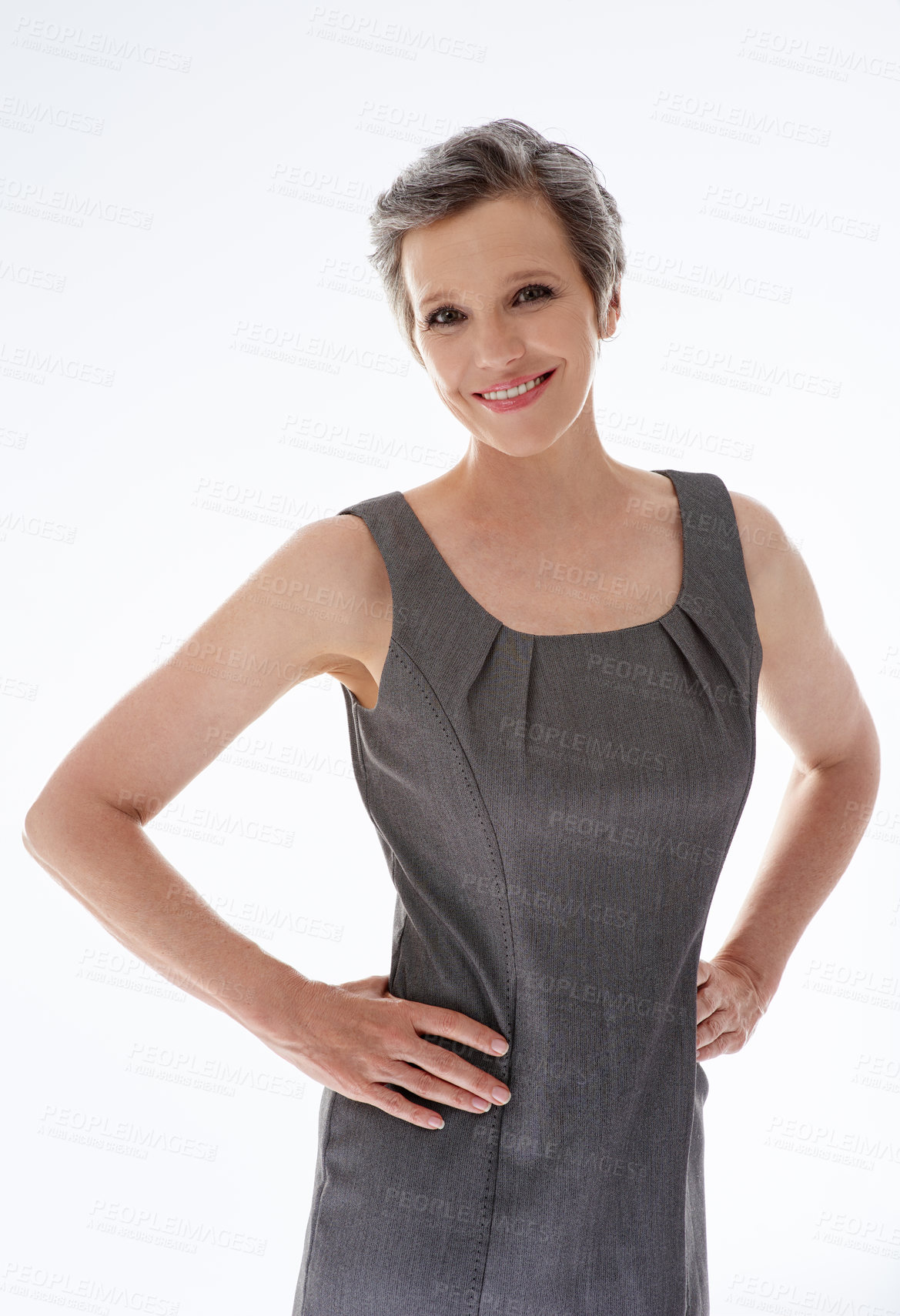 Buy stock photo A confident mature businesswoman standing against a white background