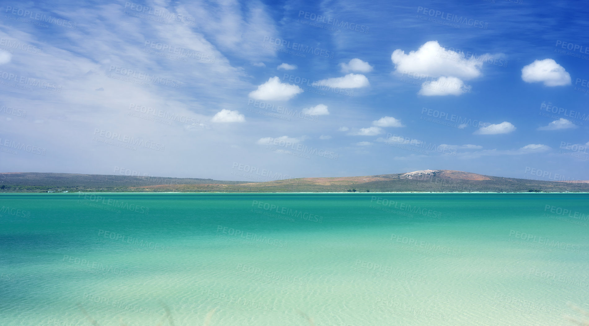 Buy stock photo Blue sky, clouds and mountain with beach in nature for travel destination, vacation and calm water. Tropical island, coast and background of sea at sunset for holiday, peace and outdoor environment