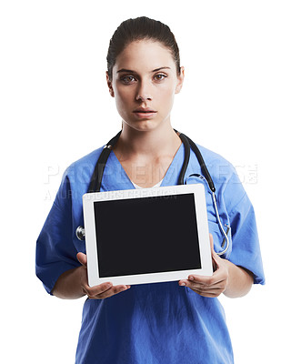 Buy stock photo Studio shot of a beautiful young doctor showing you the blank screen of a digital tablet against a white background