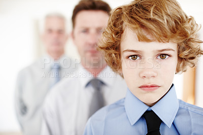 Buy stock photo Boy, portrait and serious in home with family, bonding and generations together or love. Sad male person, son and tough kid for child development, autism and adhd in childhood or people in house