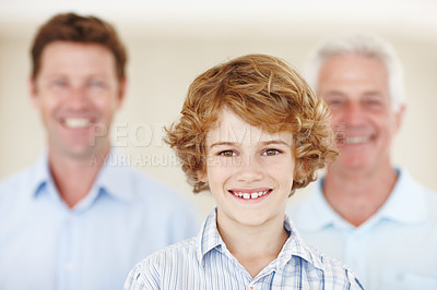 Buy stock photo Boy, portrait and smile for family in home, support and happy for together generations in lounge. Male person, care and dad or grandpa in childhood, trust and love in bonding or security in house