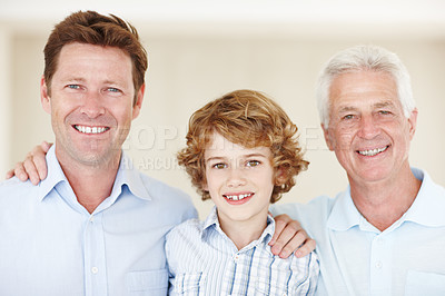 Buy stock photo Boy, portrait and hug for family in home, support and happy for generations together in lounge. Male person, care and dad or grandpa in childhood, embrace and love in bonding or security in house