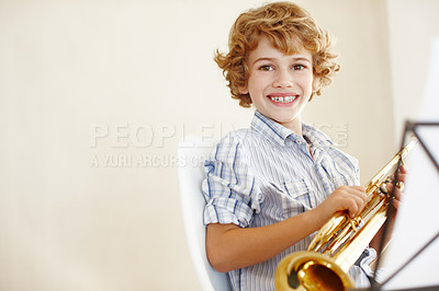 Buy stock photo Happy, music and portrait of child with trumpet for learning, lesson and practice for talent show. Mockup space, creative hobby and home with young boy with instrument, sheet and notes to play song