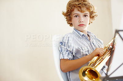 Buy stock photo Learning, music and portrait of child with trumpet for skills, lesson and practice for talent show. Musician, creative hobby and young boy with musical instrument, sheets and notes to play song