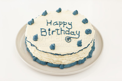 Buy stock photo High angle shot of a pretty birthday cake with blue frosting