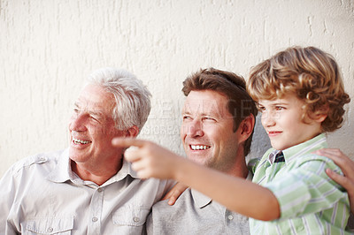 Buy stock photo Pointing, family and grandpa, dad and child in home for bonding, happy relationship and generations. Wall background, weekend and grandfather, boy and father relax in garden with view on weekend