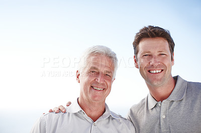 Buy stock photo Cropped portrait of a mature man and his senior father standing outside