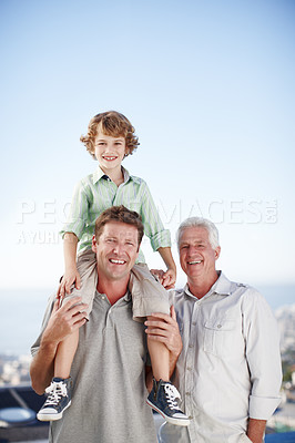Buy stock photo Cropped portrait of a young boy with his father and grandfather