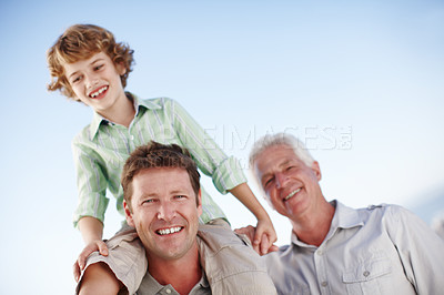 Buy stock photo Portrait of grandfather, father and child by blue sky for bonding, relationship and relax together. Family, generations and grandpa, dad and young boy on shoulders for holiday, vacation and weekend