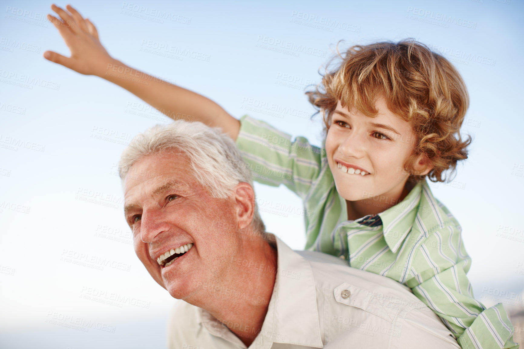 Buy stock photo Happy, blue sky and child playing with grandfather for bonding, relationship and relax together outdoors. Family, nature and grandpa with young boy on summer holiday, vacation and weekend at park