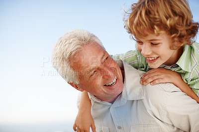 Buy stock photo Happy, piggyback and grandfather with child laugh for bonding, relationship and relax together outdoors. Family, nature and grandpa with young boy on summer holiday, vacation and weekend at park