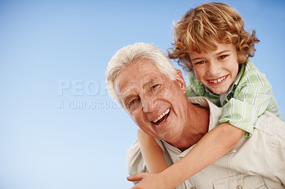 Buy stock photo Happy, piggy back and portrait of grandfather and kid for bonding, relationship and relax together outdoors. Family, nature and grandpa with young boy on summer holiday, vacation and weekend at park