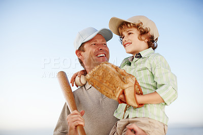 Buy stock photo Father, boy and happy for baseball, outdoor and game with hug for love, bonding and teaching. Family, papa and child with bat, glove and softball for sports, learning and embrace for fitness at field