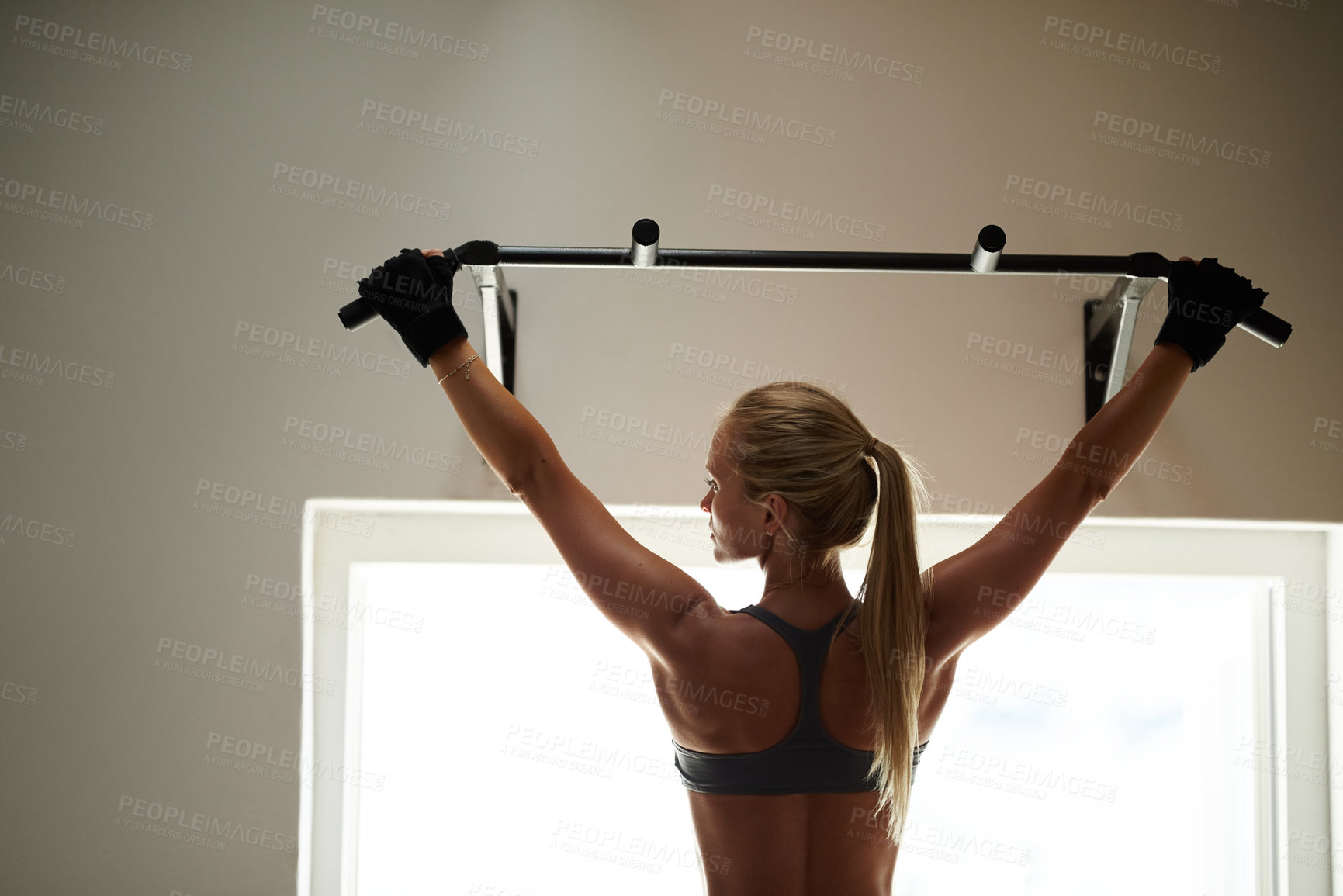 Buy stock photo Strong back, pull up or woman in gym for exercise, power and workout for fitness, body health or core. Grip, hanging and athlete on bar for biceps, arms or balance for training and muscle in home