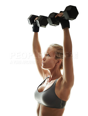 Buy stock photo Cropped shot of a beautiful young woman in workout gear lifting dumbbells