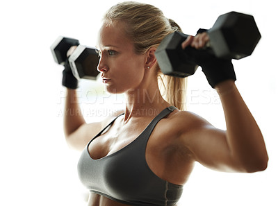 Buy stock photo Shoulder press, athlete or woman in studio with dumbbells for fitness, workout or gym for arms or health. White background, growth or bodybuilder lifting weights for exercise, body training or muscle