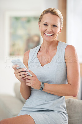 Buy stock photo Cropped portrait of an attractive businesswoman sending a text