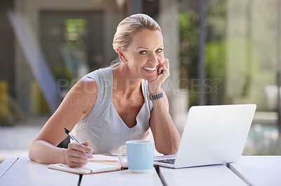 Buy stock photo Cropped portrait of an attractive businesswoman working on her laptop