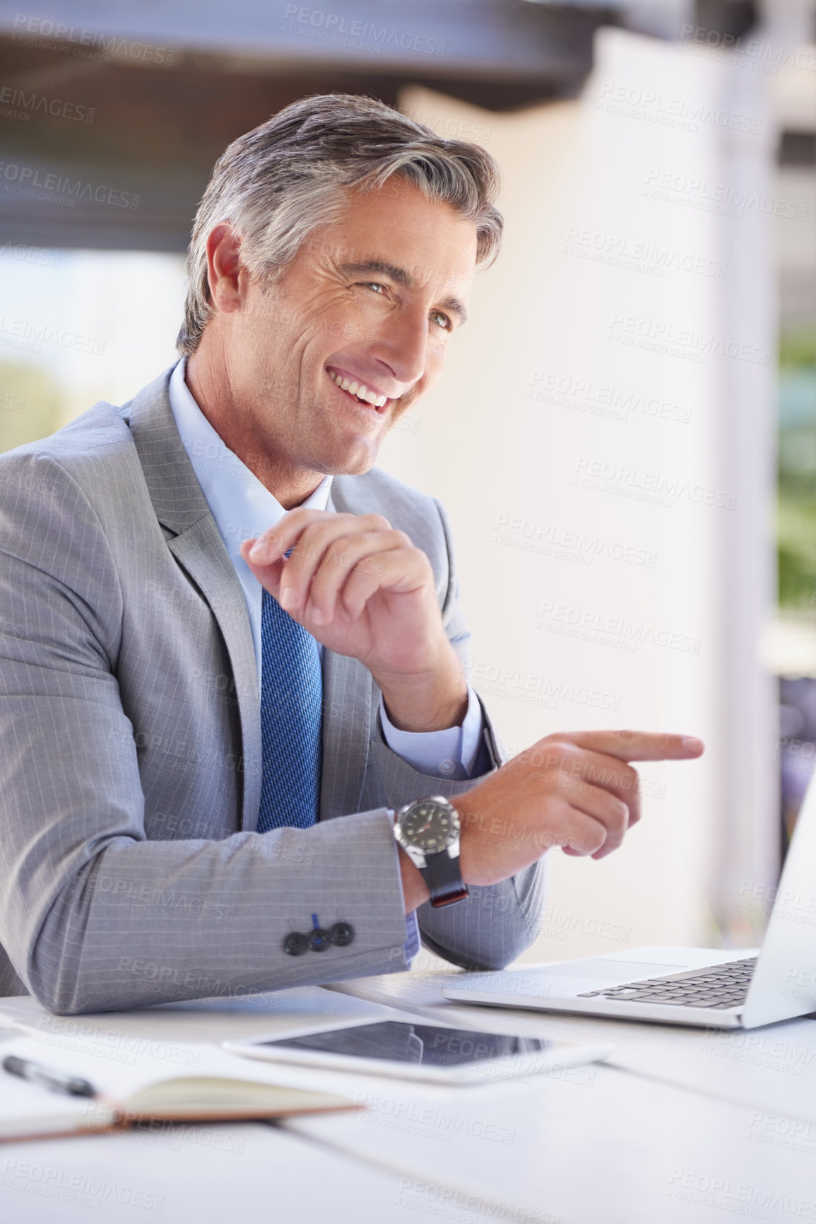 Buy stock photo Cropped shot of a handsome businessman in the office