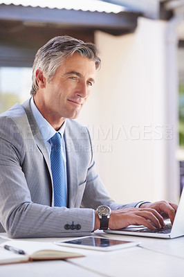 Buy stock photo Cropped shot of a handsome businessman in the office