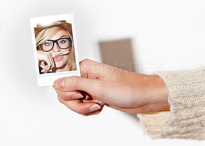 Buy stock photo Hand, photograph of a woman with a finger mustache and print in studio isolated on a white background. Face, photo booth picture and a young person closeup at a party or event for celebration