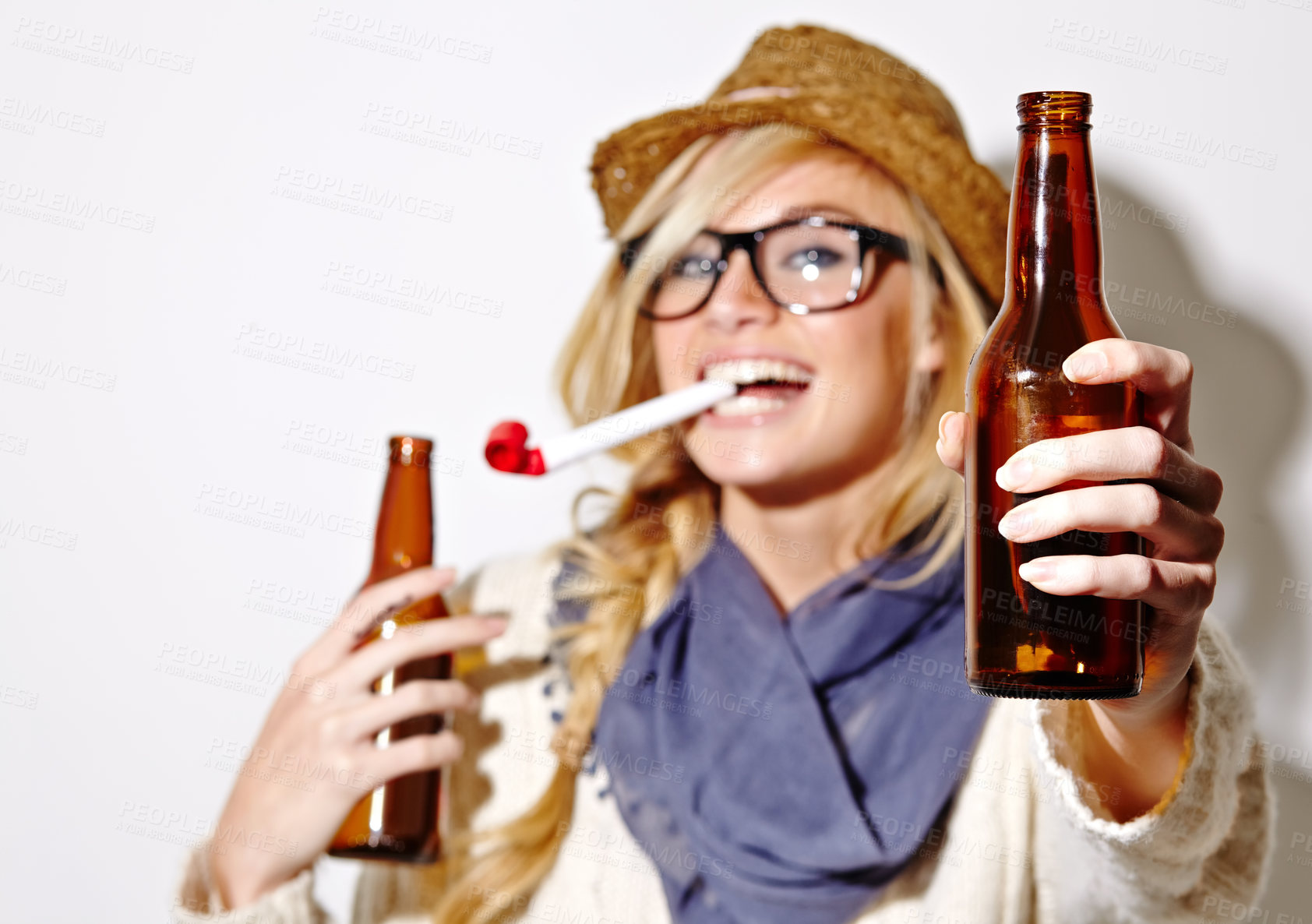 Buy stock photo Beer, portrait or happy woman with party horn for fun celebration, holiday or hipster event in studio. New year, giving or hands of person drinking alcohol or beverage in bottle on white background 
