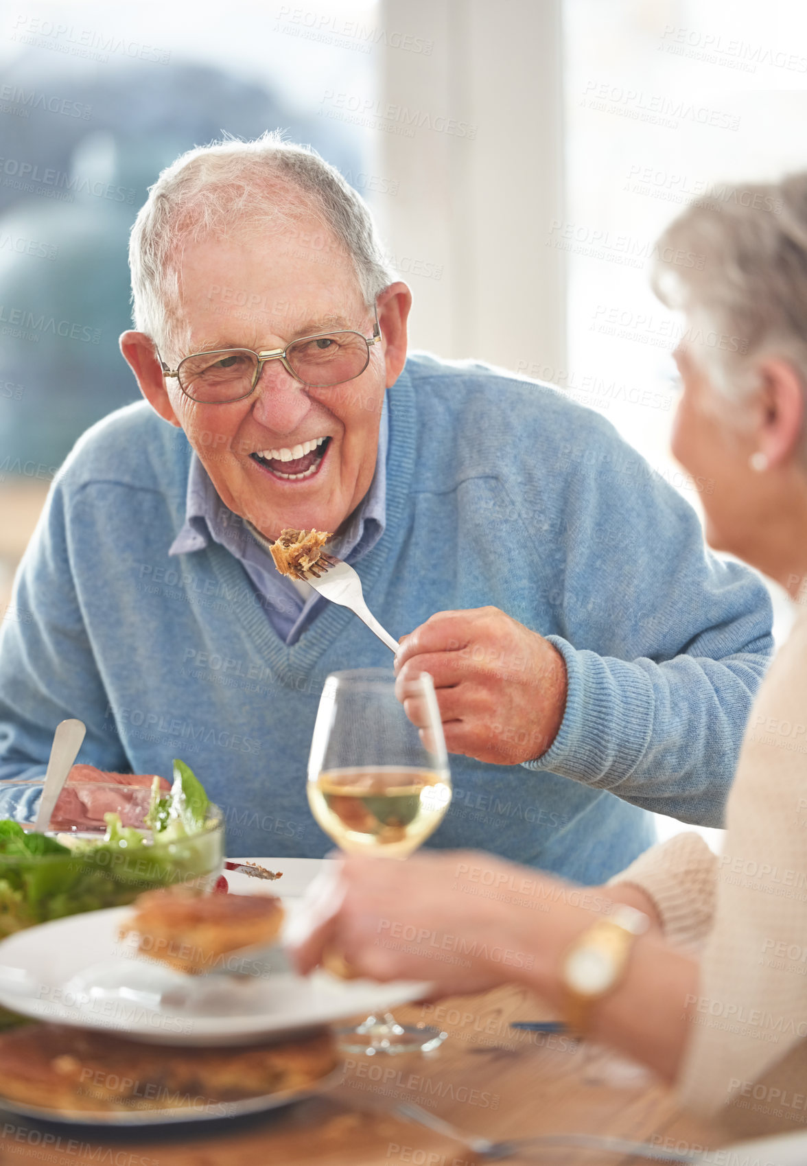 Buy stock photo Happy, love and elderly couple eating lunch together in the dining room of their modern home. Happiness, smile and senior man and woman in retirement talking, bonding and enjoying meal in their house