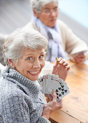 Buy stock photo Happy, portrait and old people playing cards at a nursing home for happiness, recreation and game. Smile, showing and a senior woman with a win in poker, excited and bonding with friends in games
