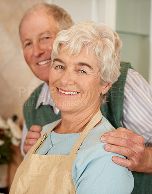 Buy stock photo Couple, elderly and portrait with smile in home for love, bonding and retirement with pension. Happy, man and woman with apron in house for commitment, cooking and dinner together for enjoyment