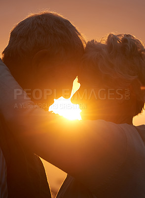 Buy stock photo Sunset, senior couple and embrace outdoor, care and bonding for connection together in nature. Man, woman and touch forehead for love, romance and hug for commitment to relationship in retirement