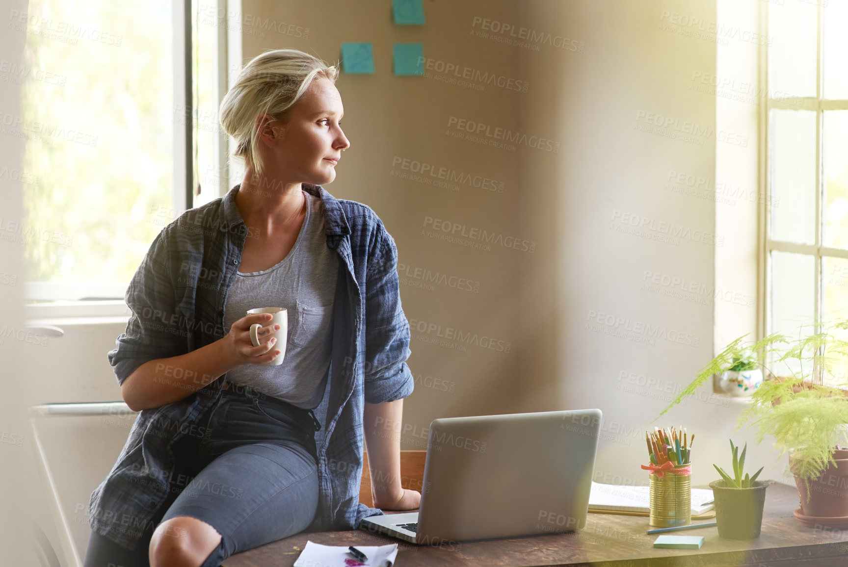 Buy stock photo Coffee, laptop and thinking with entrepreneur woman on desk in office of small business startup. Computer, design and drink with creative employee person in workplace for idea, planning or vision