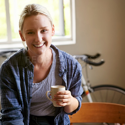 Buy stock photo Portrait of an attractive young woman having coffee at home