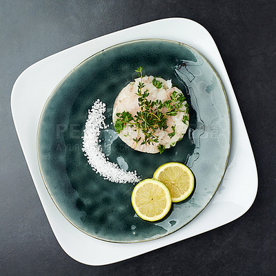 Buy stock photo Dinner, menu and plate of seafood at fine dining restaurant with lemon, salt and herbs on fish. Healthy, cooking and luxury dish with protein from gourmet fillet of tuna for nutrition in diet 