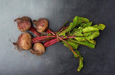 Buy stock photo High angle studio shot of delicious beetroots on a table